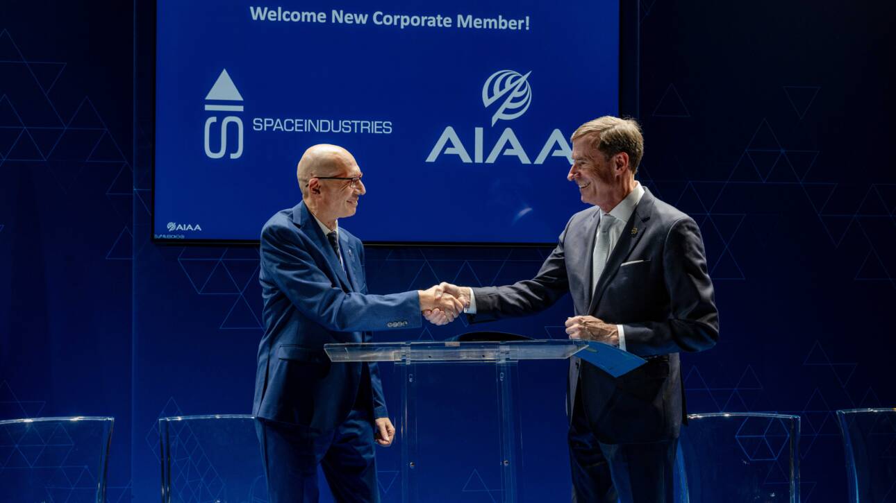 Giuseppe Santangelo (Space Industries) and Clay Mowry (AIAA) shake their hands at Palazzo Asinari di San Marzano, Turin, Italy