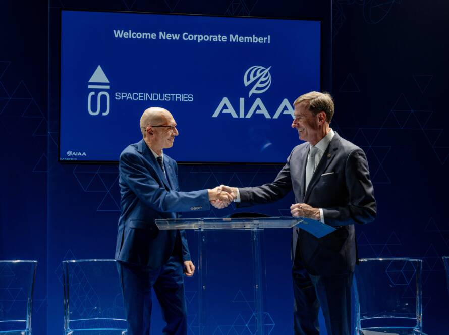 Giuseppe Santangelo (Space Industries) and Clay Mowry (AIAA) shake their hands at Palazzo Asinari di San Marzano, Turin, Italy